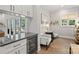 Bright kitchen nook features a wine cooler, built-in shelving, and French doors at 4311 Craig Ave, Charlotte, NC 28211