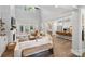 Open concept living room and kitchen with hardwood floors and high ceilings at 4311 Craig Ave, Charlotte, NC 28211
