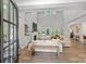 Spacious living room with high ceilings, fireplace, and access to backyard at 4311 Craig Ave, Charlotte, NC 28211