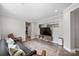 Spacious living room featuring comfortable seating and a large TV at 4311 Craig Ave, Charlotte, NC 28211