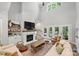 Living area with hardwood floors, fireplace, and access to the back patio at 4311 Craig Ave, Charlotte, NC 28211