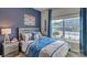 Bright bedroom with a full bed, NFL themed decor and large window at 4606 Harris Elliot Rd, Lincolnton, NC 28092