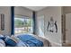 Bedroom with full bed, large window, and a football player wall decal at 4606 Harris Elliot Rd, Lincolnton, NC 28092