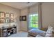 Bonus room with a sectional sofa, dartboard, and large window at 4606 Harris Elliot Rd, Lincolnton, NC 28092