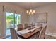 Bright dining room features a table with seating for six and access to the backyard at 4606 Harris Elliot Rd, Lincolnton, NC 28092