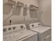 Laundry room with Whirlpool washer and dryer and shelving at 4606 Harris Elliot Rd, Lincolnton, NC 28092