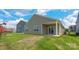 A spacious backyard features a covered patio, offering a private outdoor space for relaxation and entertaining at 4606 Harris Elliot Rd, Lincolnton, NC 28092