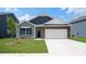 Charming single-story home showcasing a mix of siding, brick accents, and a convenient two-car garage at 4606 Harris Elliot Rd, Lincolnton, NC 28092