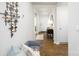 Home hallway with seating area, wood flooring, and modern wall art at 4614 Harris Elliot Rd, Lincolnton, NC 28092