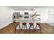 Kitchen island with granite countertop and four wooden stools at 4614 Harris Elliot Rd, Lincolnton, NC 28092