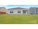 Expansive backyard featuring a covered patio and lush green grass at 4614 Harris Elliot Rd, Lincolnton, NC 28092