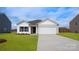 Charming single-story home featuring a two-car garage and well-manicured lawn at 4614 Harris Elliot Rd, Lincolnton, NC 28092