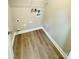 Laundry room with vinyl flooring and built in shelving at 622 N Walnut St, Kannapolis, NC 28081