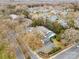 Aerial view of a neighborhood with mature trees, paved roads, and well-maintained landscaping at 7000 Quail Hill Rd, Charlotte, NC 28210