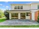 Exterior view of house with a large backyard patio and sliding glass doors at 7000 Quail Hill Rd, Charlotte, NC 28210