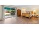 Bright bedroom with wood furniture, large sliding glass doors to patio, and a peaceful atmosphere at 7000 Quail Hill Rd, Charlotte, NC 28210