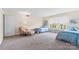 Cozy bedroom with twin beds, natural light, and a comfortable sitting area at 7000 Quail Hill Rd, Charlotte, NC 28210