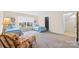 Inviting bedroom with two twin beds, large window, and cozy armchair seating area at 7000 Quail Hill Rd, Charlotte, NC 28210
