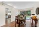 Dining room with a wooden table set and a sliding glass door providing access to the outdoors at 7000 Quail Hill Rd, Charlotte, NC 28210