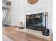 Elegant fireplace with marble surround and decorative accents creates a warm focal point in the living area at 7000 Quail Hill Rd, Charlotte, NC 28210