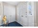 Bright foyer with tiled floors, closet, and glass table creates an inviting entry at 7000 Quail Hill Rd, Charlotte, NC 28210