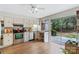 Bright kitchen features stainless steel appliances, granite countertops, and a sliding glass door to the patio at 7000 Quail Hill Rd, Charlotte, NC 28210
