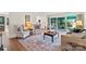 Bright living room with hardwood floors, comfortable seating, and sliding glass doors to the patio at 7000 Quail Hill Rd, Charlotte, NC 28210