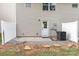 Home's backyard featuring neutral siding and a door leading to a patio at 828 Renee Ave, Fort Mill, SC 29715