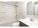 Compact bathroom featuring a white vanity, toilet, and a shower-tub combination with white tile surround at 828 Renee Ave, Fort Mill, SC 29715