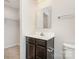 Bathroom featuring a sleek dark vanity with mirror, and a toilet in a neutral space at 828 Renee Ave, Fort Mill, SC 29715