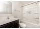 Cozy bathroom with dark wood cabinets, bathtub with shower, and decorated with 'Soak Your Troubles Away' sign at 828 Renee Ave, Fort Mill, SC 29715