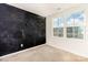 Unique bedroom featuring a dark accent wall and large window offering natural light at 828 Renee Ave, Fort Mill, SC 29715