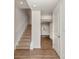 Welcoming entryway featuring hardwood-style floors, staircase and neutral paint at 828 Renee Ave, Fort Mill, SC 29715