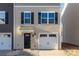 Charming two-story home featuring a one-car garage and a welcoming front door at 828 Renee Ave, Fort Mill, SC 29715