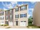 Beautiful townhouse with tan siding, black shutters and single car garage at 828 Renee Ave, Fort Mill, SC 29715