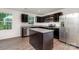 Modern kitchen featuring stainless steel appliances, dark wood cabinets and granite countertops at 828 Renee Ave, Fort Mill, SC 29715