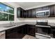 Close-up of the modern kitchen with stainless steel appliances and granite countertops at 828 Renee Ave, Fort Mill, SC 29715