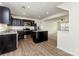 Modern kitchen with stainless steel appliances, dark wood cabinets and granite countertops at 828 Renee Ave, Fort Mill, SC 29715