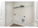 Functional laundry room with a wire rack, with connections for a washer and dryer at 828 Renee Ave, Fort Mill, SC 29715