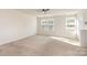 Spacious living room featuring neutral carpet, a ceiling fan, and lots of natural light at 828 Renee Ave, Fort Mill, SC 29715