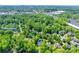 Wide aerial view showing home's location in a wooded area at 908 Thorn Ridge Ln, Lake Wylie, SC 29710