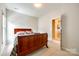 Well-lit bedroom with a double bed and access to a hallway at 908 Thorn Ridge Ln, Lake Wylie, SC 29710