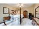 Spacious bedroom with a four poster bed, ample light and built in shelving at 908 Thorn Ridge Ln, Lake Wylie, SC 29710