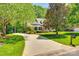 Curved driveway leading to a charming brick home at 908 Thorn Ridge Ln, Lake Wylie, SC 29710