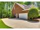 Attached brick garage with a large driveway at 908 Thorn Ridge Ln, Lake Wylie, SC 29710