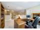 Spacious home office with desk, built-in shelving, and view of hallway at 908 Thorn Ridge Ln, Lake Wylie, SC 29710