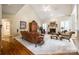 Spacious living room with hardwood floors, fireplace, and high ceilings at 908 Thorn Ridge Ln, Lake Wylie, SC 29710