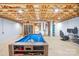 Finished basement with pool table and gaming area at 1047 College Ave, Shelby, NC 28152