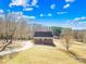 Brick house with front porch and long driveway at 1047 College Ave, Shelby, NC 28152