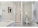 Clean bathroom featuring a shower with glass door, toilet, and white vanity with stone countertop at 1103 N Sharon Amity Rd, Charlotte, NC 28211